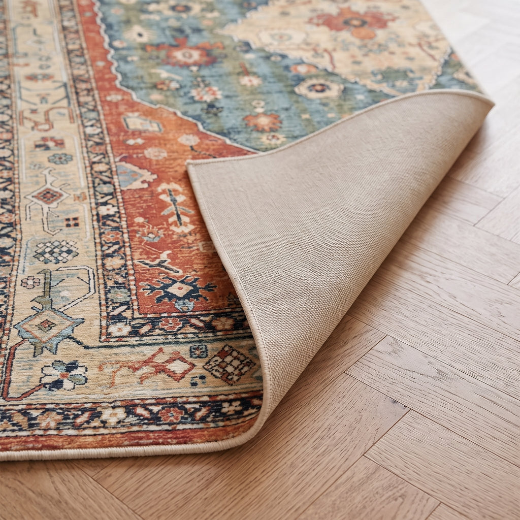 Amira Persian-style rug, folded corner showing the low pile and non-slip backing
