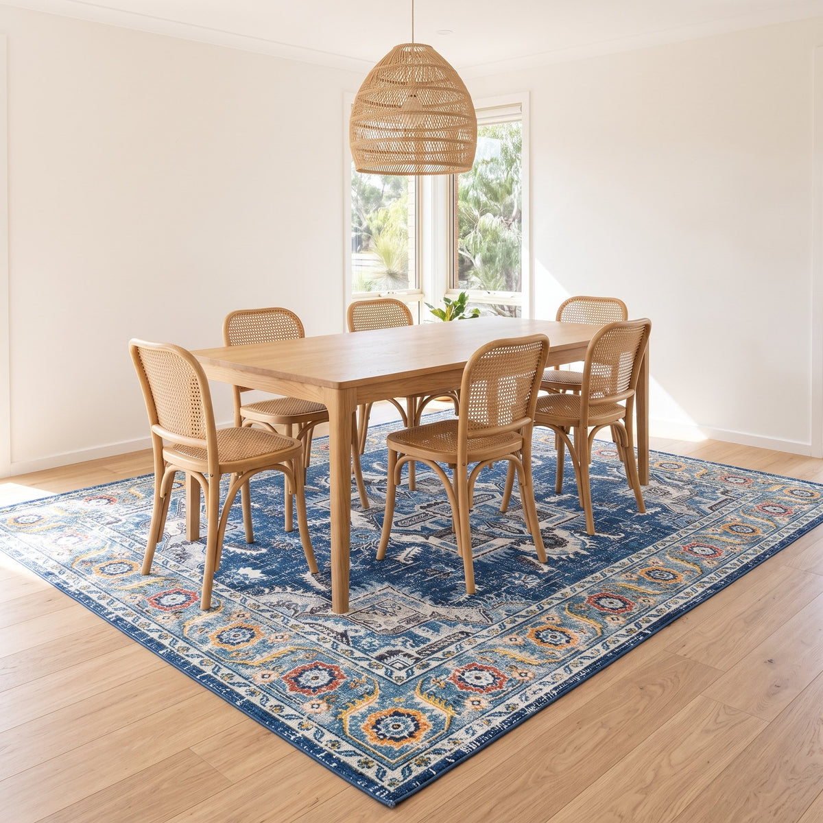 Azure Persian-style rug under a dining table