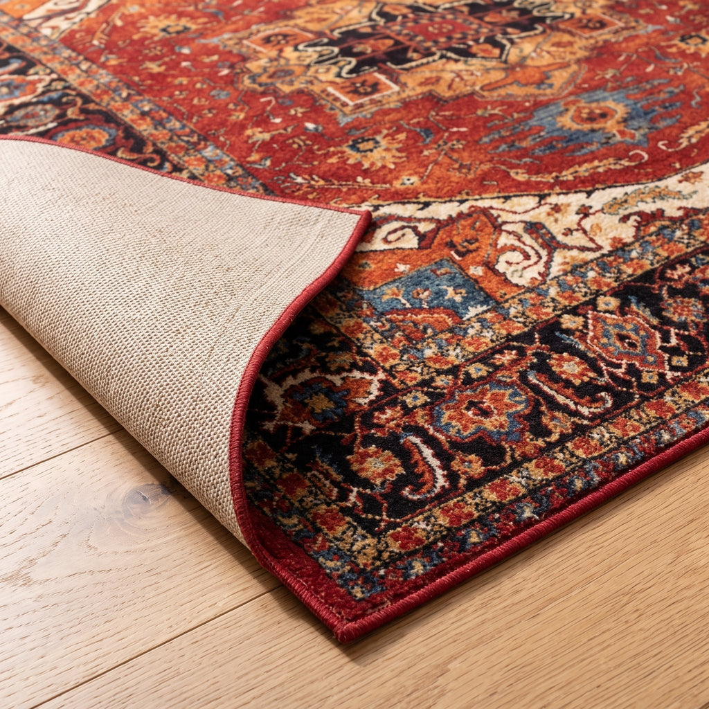 Heriz Persian-style rug, folded corner showing the low pile and non-slip backing