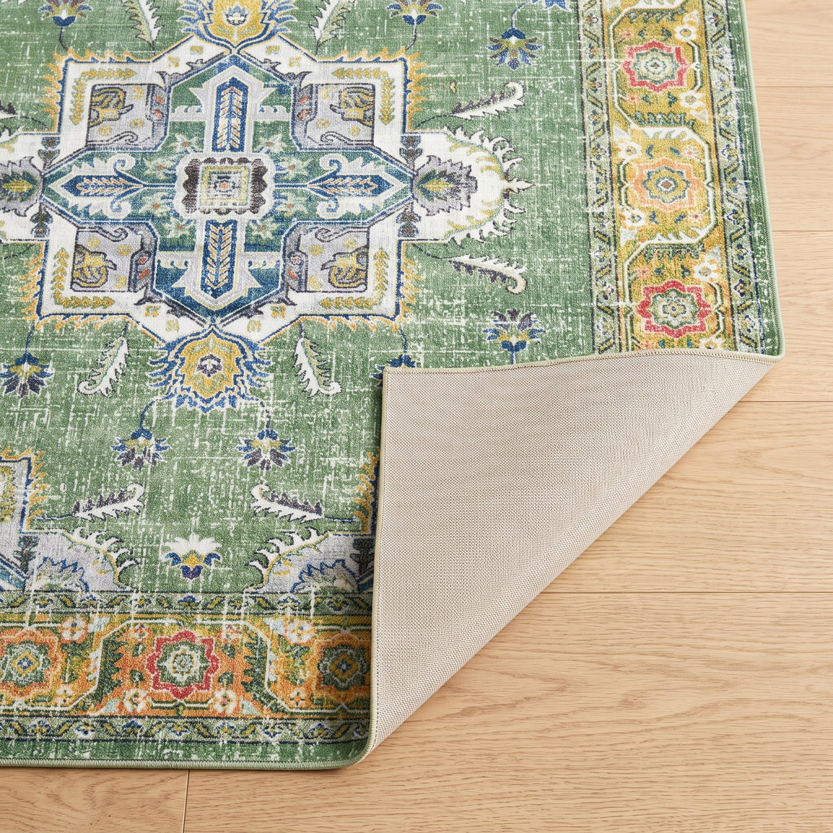 Willow Persian-style rug, folded corner showing the low pile and non-slip backing